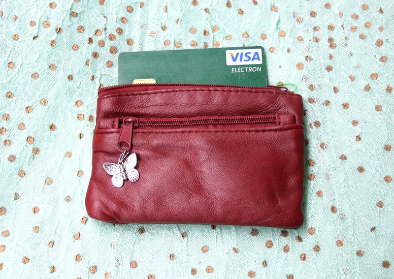 Small purse in genuine leather. Burgundy coin purse with 3 Zippers, fits credit cards, coins, bills. Small leather wallet
