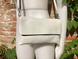 Small leather bag in light beige. Broken white cross body bag in GENUINE leather. Cream color bag with adjustable strap, zipper and flap.