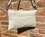 Small leather bag in light beige. Broken white cross body bag in GENUINE leather. Cream color bag with adjustable strap, zipper and flap.
