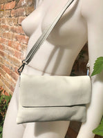 Small leather bag in light beige. Broken white cross body bag in GENUINE leather. Cream color bag with adjustable strap, zipper and flap.