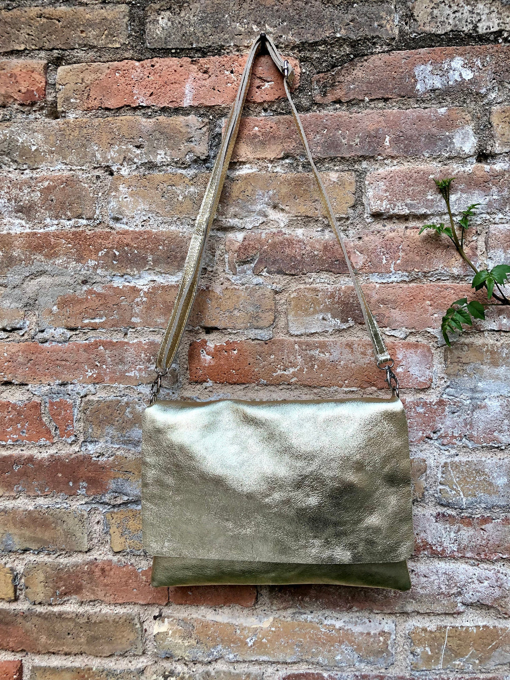 Genuine leather bag in GOLD. Cross body bag or shoulder bag in metallic shine leather. Adjustable strap, zipper and flap.Glitter leather bag