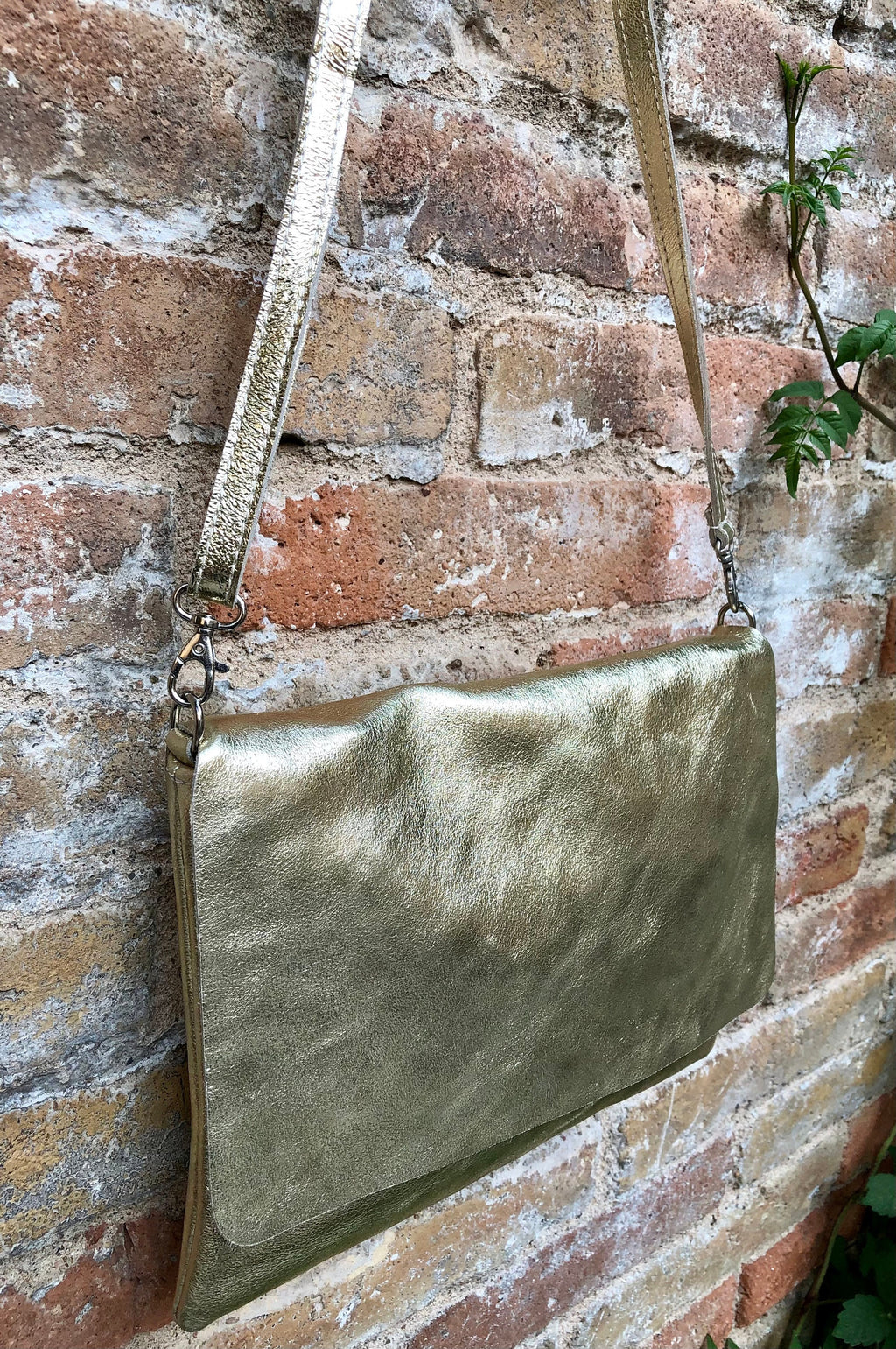 Genuine leather bag in GOLD. Cross body bag or shoulder bag in metallic shine leather. Adjustable strap, zipper and flap.Glitter leather bag