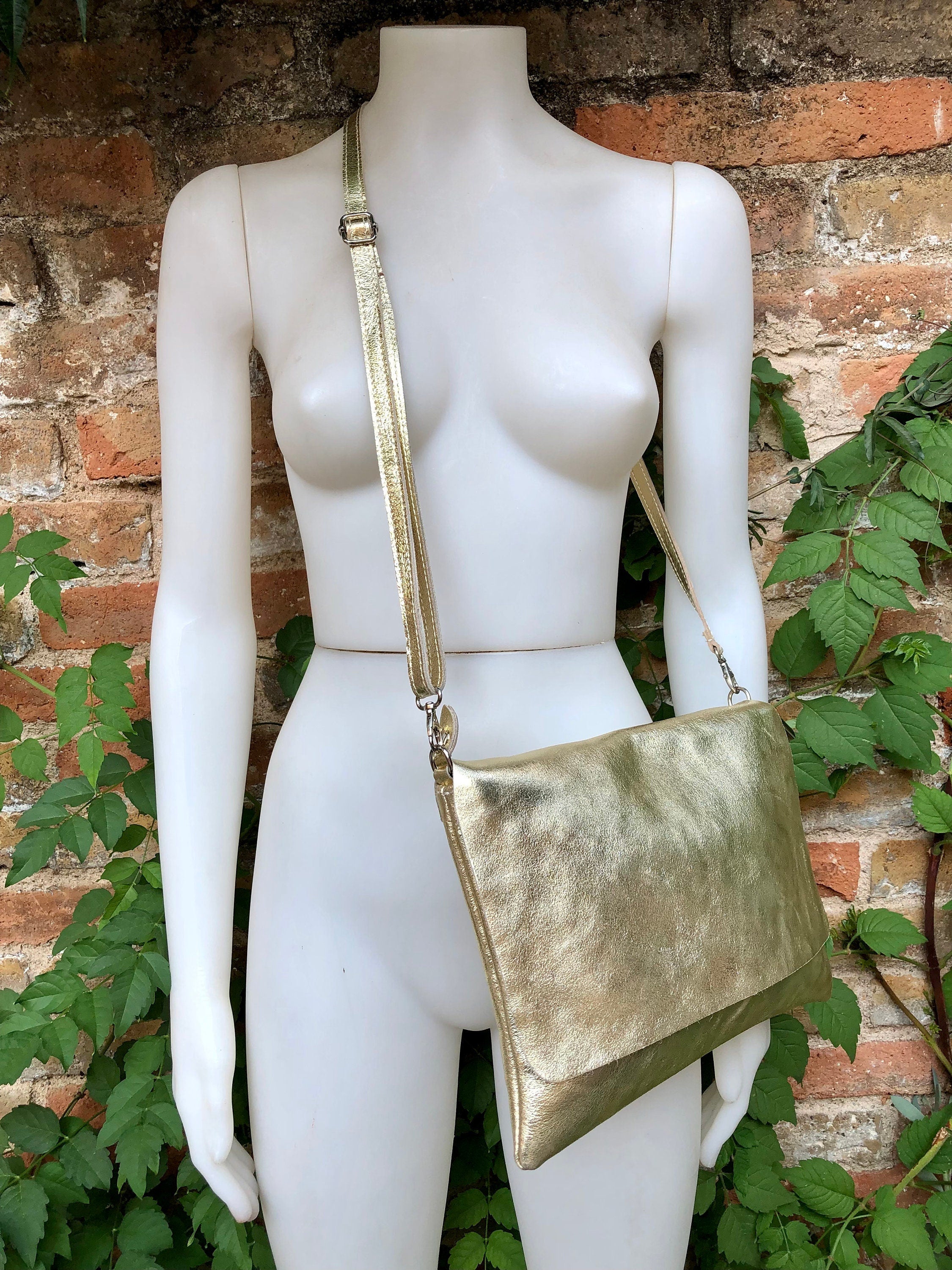 Genuine leather bag in GOLD. Cross body bag or shoulder bag in metallic shine leather. Adjustable strap, zipper and flap.Glitter leather bag