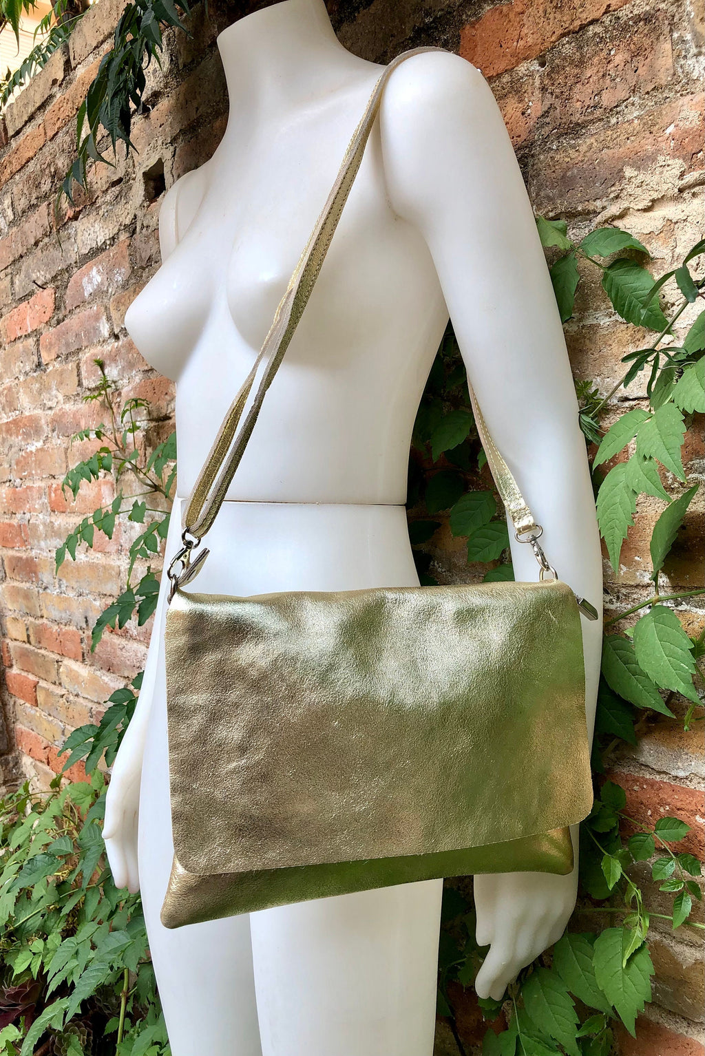Genuine leather bag in GOLD. Cross body bag or shoulder bag in metallic shine leather. Adjustable strap, zipper and flap.Glitter leather bag