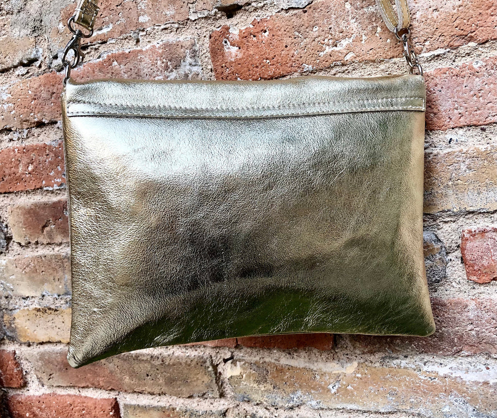 Genuine leather bag in GOLD. Cross body bag or shoulder bag in metallic shine leather. Adjustable strap, zipper and flap.Glitter leather bag