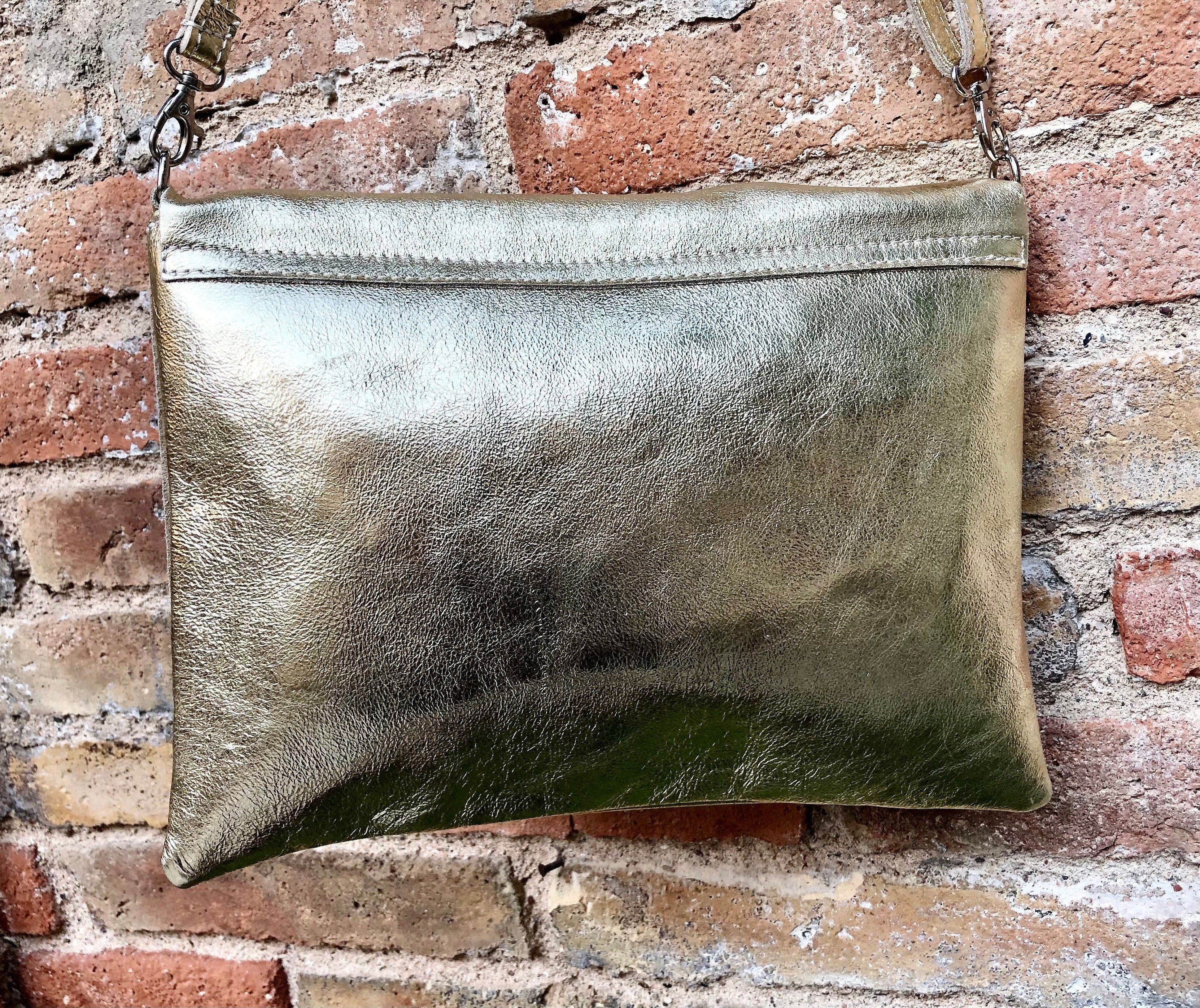 Genuine leather bag in GOLD. Cross body bag or shoulder bag in metallic shine leather. Adjustable strap, zipper and flap.Glitter leather bag