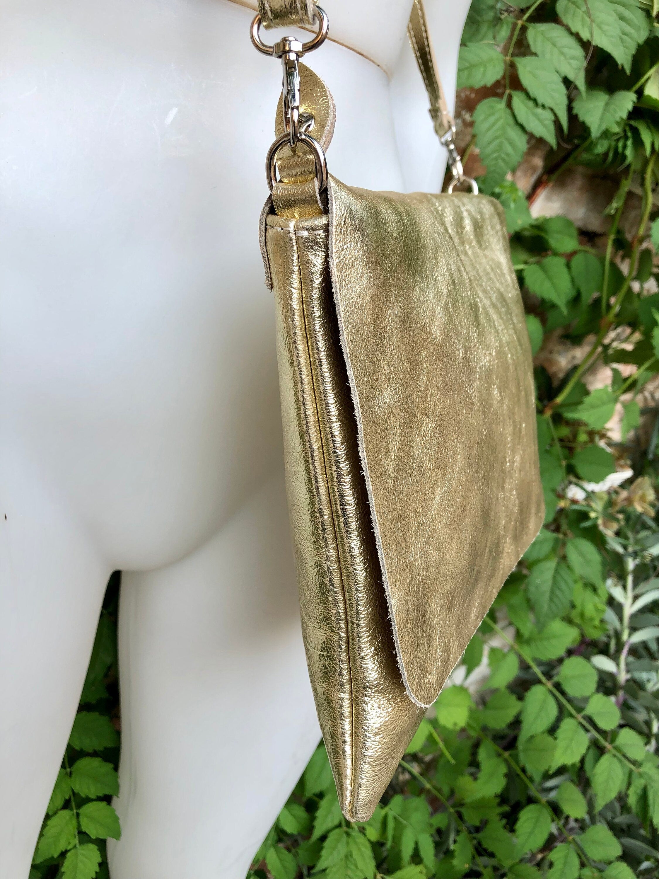 Genuine leather bag in GOLD. Cross body bag or shoulder bag in metallic shine leather. Adjustable strap, zipper and flap.Glitter leather bag