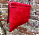 RED genuine leather bag. Cross body bag or shoulder bag in grain leather.Adjustable strap, zipper and flap.Hardware in BRONZE. Red purse