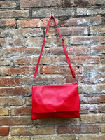 RED genuine leather bag. Cross body bag or shoulder bag in grain leather.Adjustable strap, zipper and flap.Medium size RED leather messenger