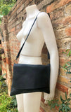 BLACK genuine leather bag. Cross body bag or shoulder bag in grain leather. Adjustable strap, zipper and flap. Medium size leather messenger