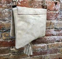 Cross body bag. BOHO suede leather bag in beige. Soft genuine suede leather. Crossover, messenger bag in suede. Small boho bag with tassel.