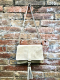 Cross body bag. BOHO suede leather bag in beige. Soft genuine suede leather. Crossover, messenger bag in suede. Small boho bag with tassel.