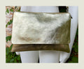 Genuine leather bag in GOLD. Cross body bag or shoulder bag in metallic shine leather. Adjustable strap, zipper and flap.Glitter leather bag
