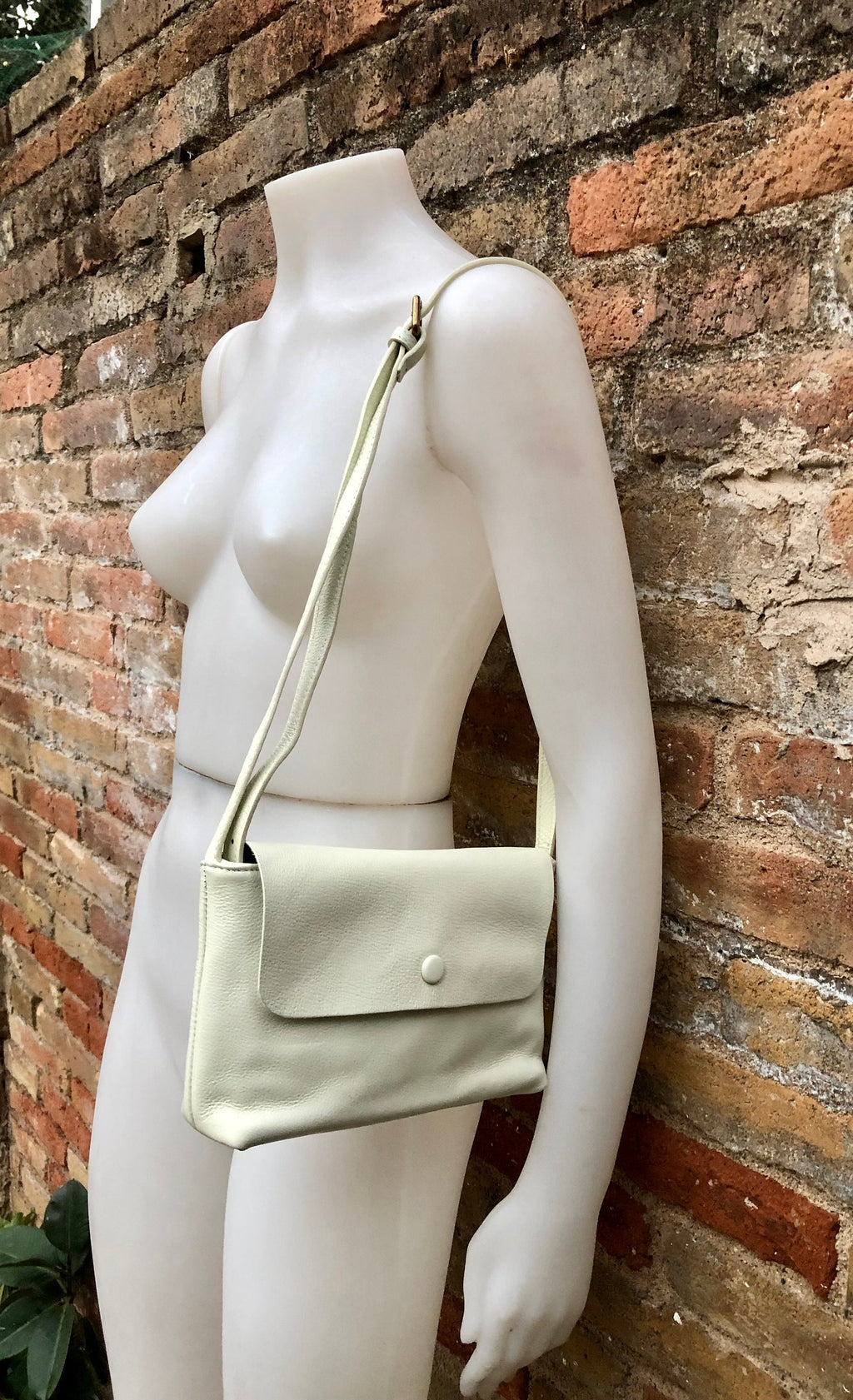 Small leather bag in cream beige. Cross body or shoulder bag in GENUINE leather. Beige leather bag with adjustable strap, zipper and flap.