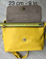 Small leather bag in yellow. Cross body or shoulder bag in GENUINE leather. Yellow leather bag with adjustable strap, zipper and flap.