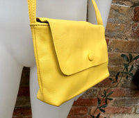 Small leather bag in yellow. Cross body or shoulder bag in GENUINE leather. Yellow leather bag with adjustable strap, zipper and flap.