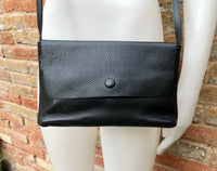 Small leather bag in black. Cross body or shoulder bag in GENUINE leather. Black leather bag with adjustable strap, zipper and flap.