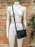 Small leather bag in black. Cross body or shoulder bag in GENUINE leather. Black leather bag with adjustable strap, zipper and flap.