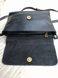 Small leather bag in black. Cross body or shoulder bag in GENUINE leather. Black leather bag with adjustable strap, zipper and flap.