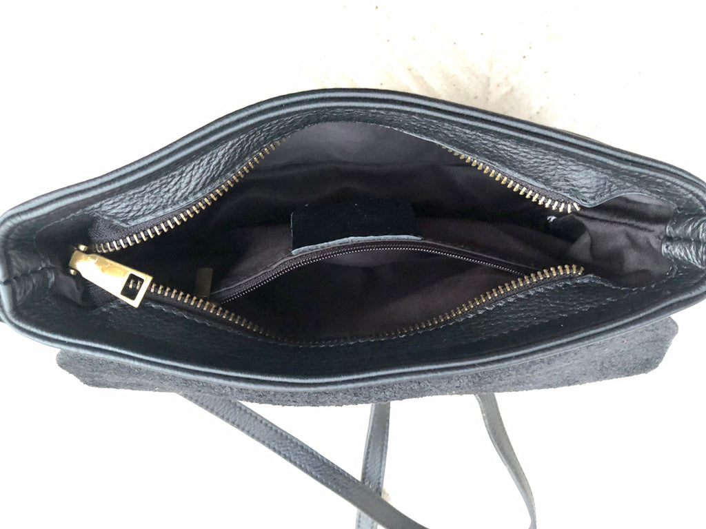 Small leather bag in black. Cross body or shoulder bag in GENUINE leather. Black leather bag with adjustable strap, zipper and flap.