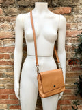 Small camel brown genuine leather bag. Light brown cross body or shoulder bag. Tan leather purse with adjustable strap zipper and flap.