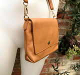 Small camel brown genuine leather bag. Light brown cross body or shoulder bag. Tan leather purse with adjustable strap zipper and flap.