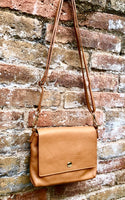 Small camel brown genuine leather bag. Light brown cross body or shoulder bag. Tan leather purse with adjustable strap zipper and flap.