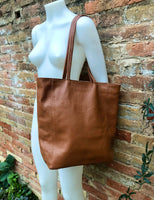 NEW with zipper and lining. large tote leather bag in CAMEL BROWN. Soft genuine leather shopper. Carry all bag for laptops, tablets, books..