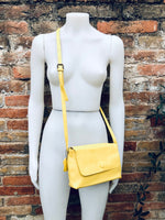 Small leather bag in yellow. Cross body or shoulder bag in GENUINE leather. Yellow leather bag with adjustable strap, zipper and flap.