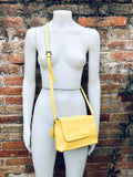 Small leather bag in yellow. Cross body or shoulder bag in GENUINE leather. Yellow leather bag with adjustable strap, zipper and flap.