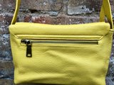 Small leather bag in yellow. Cross body or shoulder bag in GENUINE leather. Yellow leather bag with adjustable strap, zipper and flap.