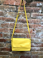 Small leather bag in yellow. Cross body or shoulder bag in GENUINE leather. Yellow leather bag with adjustable strap, zipper and flap.