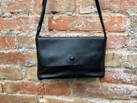 Small leather bag in black. Cross body or shoulder bag in GENUINE leather. Black leather bag with adjustable strap, zipper and flap.