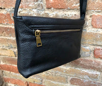 Small leather bag in black. Cross body or shoulder bag in GENUINE leather. Black leather bag with adjustable strap, zipper and flap.