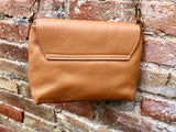 Small camel brown genuine leather bag. Light brown cross body or shoulder bag. Tan leather purse with adjustable strap zipper and flap.