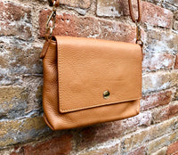 Small camel brown genuine leather bag. Light brown cross body or shoulder bag. Tan leather purse with adjustable strap zipper and flap.