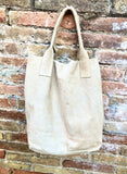 Beige leather shopper bag in genuine suede. Slouchy beige carry all tote bag for laptops, tablets, books. Suede leather purse with tassel