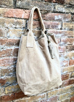 Beige leather shopper bag in genuine suede. Slouchy beige carry all tote bag for laptops, tablets, books. Suede leather purse with tassel