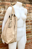 Beige leather shopper bag in genuine suede. Slouchy beige carry all tote bag for laptops, tablets, books. Suede leather purse with tassel