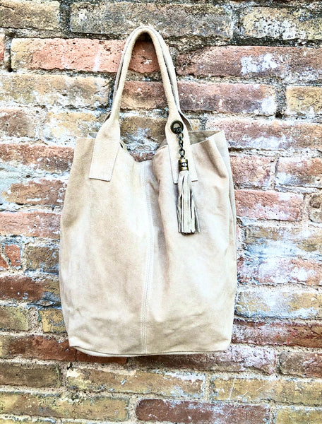 Beige leather shopper bag in genuine suede. Slouchy beige carry all tote bag for laptops, tablets, books. Suede leather purse with tassel