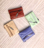 Small coin purse in genuine leather, 3 zippers. Fits credit cards, coins, bills. Small leather wallet. Beige, brown, purple, aqua green.