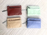 Small coin purse in genuine leather, 3 zippers. Fits credit cards, coins, bills. Small leather wallet. Beige, brown, purple, aqua green.