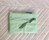 Small coin purse in genuine leather, 3 zippers. Fits credit cards, coins, bills. Small leather wallet. Beige, brown, purple, aqua green.