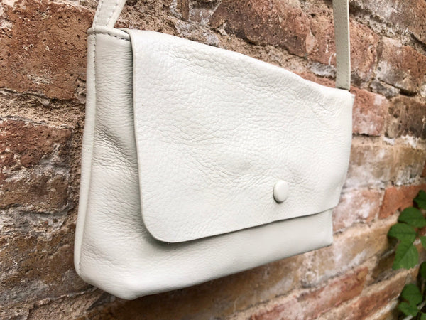 Small white leather bag. Genuine leather cross body / shoulder bag. Adjustable strap, zipper + flap. Small white leather purse.