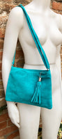 TURQUOISE suede leather bag. GENUINE leather small crossbody / shoulder bag.Adjustable strap and zipper. Turquoise blue purse with tassel.