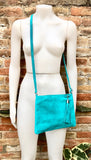 TURQUOISE suede leather bag. GENUINE leather small crossbody / shoulder bag.Adjustable strap and zipper. Turquoise blue purse with tassel.