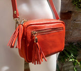 Small orange leather bag. GENUINE leather shoulder or cross body bag. Bright orange leather purse with tassels, adjustable strap and zipper