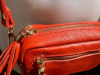 Small orange leather bag. GENUINE leather shoulder or cross body bag. Bright orange leather purse with tassels, adjustable strap and zipper