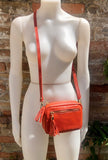 Small orange leather bag. GENUINE leather shoulder or cross body bag. Bright orange leather purse with tassels, adjustable strap and zipper