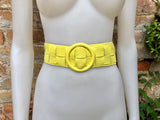 Bright yellow leather waist belt with large round buckle. Boho soft genuine leather belt in yellow. Wide waist belt. Braided leather